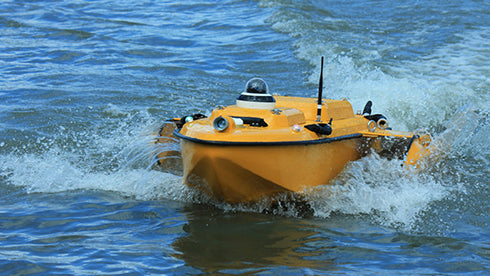 CHCNAV Apache 6 USV conducting bathymetric mapping on open water
