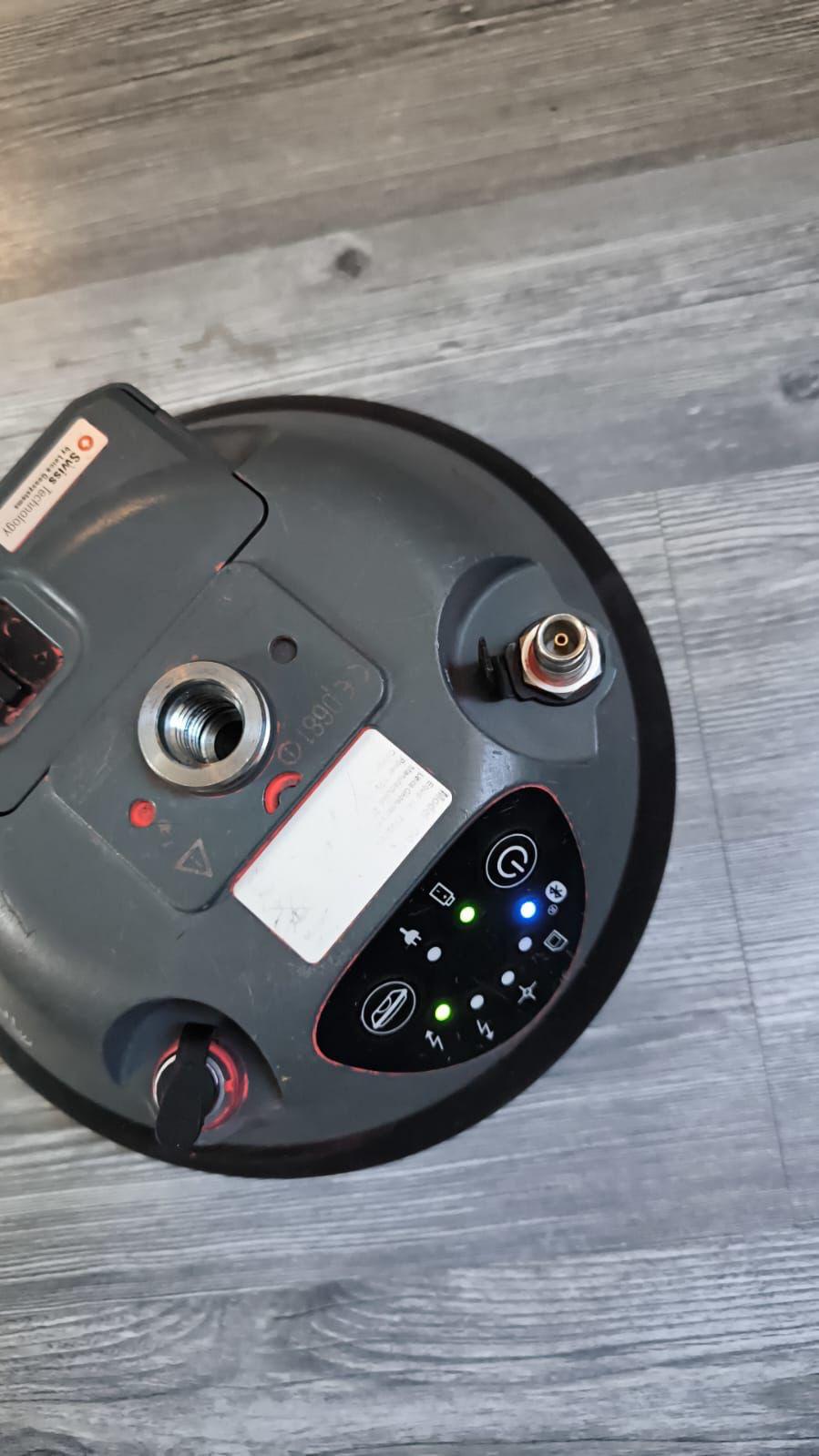 Side view of Leica GS16 GNSS Receiver on survey tripod