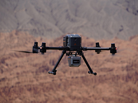 CHCNAV X500 multirotor UAV flying with high-payload LiDAR survey equipment